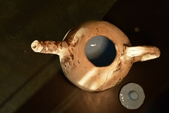 Slabbuilt tea-pot. Clay in different colours, glazed.